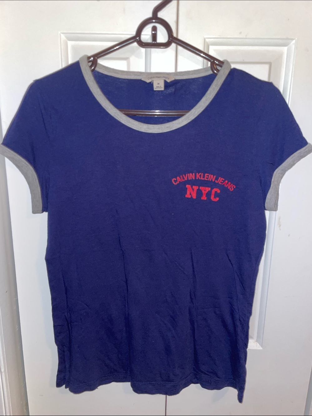 Calvin Klein Jeans Navy Tee with Red NYC Logo and Gray Trim